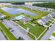 Aerial view of community featuring homes, lake, and amenities at 515 Purple Finch Rd, Summerville, SC 29486