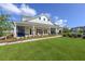 Community clubhouse with a welcoming porch and landscaping at 515 Purple Finch Rd, Summerville, SC 29486