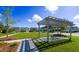 Relaxing pergola in a community green space with homes nearby at 515 Purple Finch Rd, Summerville, SC 29486