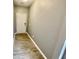 Gray hallway with light gray walls, and wood-look flooring at 515 Purple Finch Rd, Summerville, SC 29486