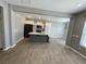 Open kitchen with white cabinets, gray island, and black appliances at 515 Purple Finch Rd, Summerville, SC 29486