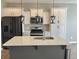 Modern kitchen with white cabinets and a large island at 515 Purple Finch Rd, Summerville, SC 29486