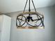 Wood and metal circular dining room light fixture at 515 Purple Finch Rd, Summerville, SC 29486