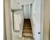 Staircase with carpeted steps and white railing at 515 Purple Finch Rd, Summerville, SC 29486