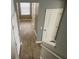 Upstairs hallway with wood-look flooring and two closed doors at 515 Purple Finch Rd, Summerville, SC 29486