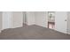 Spacious bedroom with neutral carpeting and ample closet space at 5211 Fernland Way, North Charleston, SC 29420