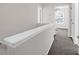Upstairs hallway with carpet and neutral-colored walls at 5211 Fernland Way, North Charleston, SC 29420