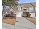 Tan and green houses with attached garages and landscaping at 5211 Fernland Way, North Charleston, SC 29420