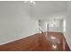 Open concept living room with hardwood floors and access to kitchen at 5211 Fernland Way, North Charleston, SC 29420