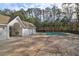 Community pool with covered changing rooms and surrounding trees at 5211 Fernland Way, North Charleston, SC 29420