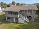 Elevated beach cottage with large yard and ocean views at 609 Palmetto Blvd, Edisto Beach, SC 29438