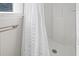 Simple bathroom with a shower stall and white curtain at 609 Palmetto Blvd, Edisto Beach, SC 29438