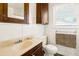 Clean bathroom with a toilet, sink, and shower/tub combo at 609 Palmetto Blvd, Edisto Beach, SC 29438