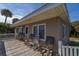 Spacious deck with multiple rocking chairs and ocean views at 609 Palmetto Blvd, Edisto Beach, SC 29438