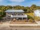 Elevated beach house with a large deck and ocean views at 609 Palmetto Blvd, Edisto Beach, SC 29438