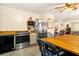 Kitchen features stainless steel appliances and a large wooden dining table at 609 Palmetto Blvd, Edisto Beach, SC 29438