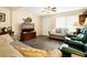 Living room with comfy seating, hardwood floors, and large TV at 609 Palmetto Blvd, Edisto Beach, SC 29438