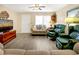 Living room with comfy seating, hardwood floors, and large TV at 609 Palmetto Blvd, Edisto Beach, SC 29438