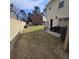 Small, grassy backyard with patio and storage at 6884 Shahid Row, North Charleston, SC 29418