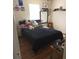 Cozy bedroom with plush bed and hardwood floors at 6884 Shahid Row, North Charleston, SC 29418