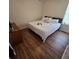 Large bedroom featuring a king-size bed and hardwood floors at 6884 Shahid Row, North Charleston, SC 29418