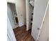 Clean hallway with linen closet and bathroom access at 6884 Shahid Row, North Charleston, SC 29418