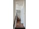 Upstairs hallway with wood flooring and access to bedrooms at 6884 Shahid Row, North Charleston, SC 29418
