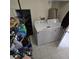 Laundry room with washer, dryer, and storage shelving at 6884 Shahid Row, North Charleston, SC 29418