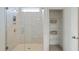 Bathroom with a glass-enclosed shower and linen closet at 729 Opal Wing St, Moncks Corner, SC 29461