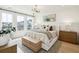 Bright bedroom with king-size bed, wood dresser, and large windows at 729 Opal Wing St, Moncks Corner, SC 29461