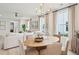 Elegant dining room with a round table and chandelier at 729 Opal Wing St, Moncks Corner, SC 29461