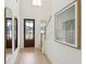 Two-story entryway with hardwood floors, mirrors, and stairs at 729 Opal Wing St, Moncks Corner, SC 29461
