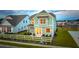 Two-story light green house with white trim, and a white picket fence at 729 Opal Wing St, Moncks Corner, SC 29461