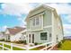 Light green house with white trim and a white picket fence at 729 Opal Wing St, Moncks Corner, SC 29461