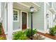 Charming front door entry with a black lantern light at 729 Opal Wing St, Moncks Corner, SC 29461