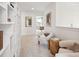 Upper hallway with built-in shelving, comfortable seating, and natural light at 729 Opal Wing St, Moncks Corner, SC 29461