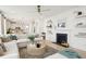 Bright living room features a sectional sofa, fireplace, and built-in shelving at 729 Opal Wing St, Moncks Corner, SC 29461