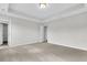 Spacious bedroom with neutral carpeting and ample natural light at 733 Opal Wing St, Moncks Corner, SC 29461