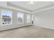 Bright bedroom featuring three windows and a neutral color scheme at 733 Opal Wing St, Moncks Corner, SC 29461