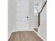 Front entry featuring hardwood floors and white door at 733 Opal Wing St, Moncks Corner, SC 29461