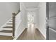 Bright entryway with hardwood floors and staircase at 733 Opal Wing St, Moncks Corner, SC 29461