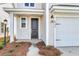 House exterior featuring a black front door, and white siding at 733 Opal Wing St, Moncks Corner, SC 29461