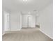 Long hallway with access to bedrooms and laundry room at 733 Opal Wing St, Moncks Corner, SC 29461