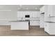 Modern kitchen with white cabinets and granite countertops at 733 Opal Wing St, Moncks Corner, SC 29461