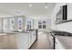 Eat-in kitchen with white cabinets, granite counters, and island at 733 Opal Wing St, Moncks Corner, SC 29461