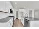 Modern kitchen with white cabinets, granite counters, and stainless appliances at 733 Opal Wing St, Moncks Corner, SC 29461