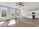 Open living space with hardwood floors and kitchen access at 733 Opal Wing St, Moncks Corner, SC 29461