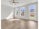 Spacious living room with hardwood floors and access to backyard at 733 Opal Wing St, Moncks Corner, SC 29461