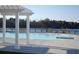 Stunning view of pool and lake from pergola at 733 Opal Wing St, Moncks Corner, SC 29461