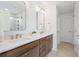 Modern bathroom with double vanity, large mirror, and walk-in shower at 735 Opal Wing St, Moncks Corner, SC 29461